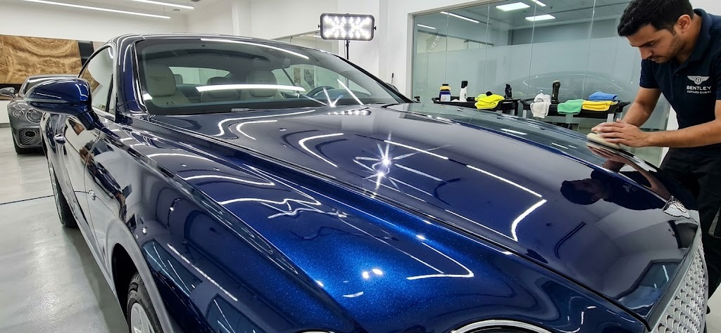 Bentley ceramic coating in Dubai showing deep gloss and mirror reflection on a freshly coated Bentley bonnet
